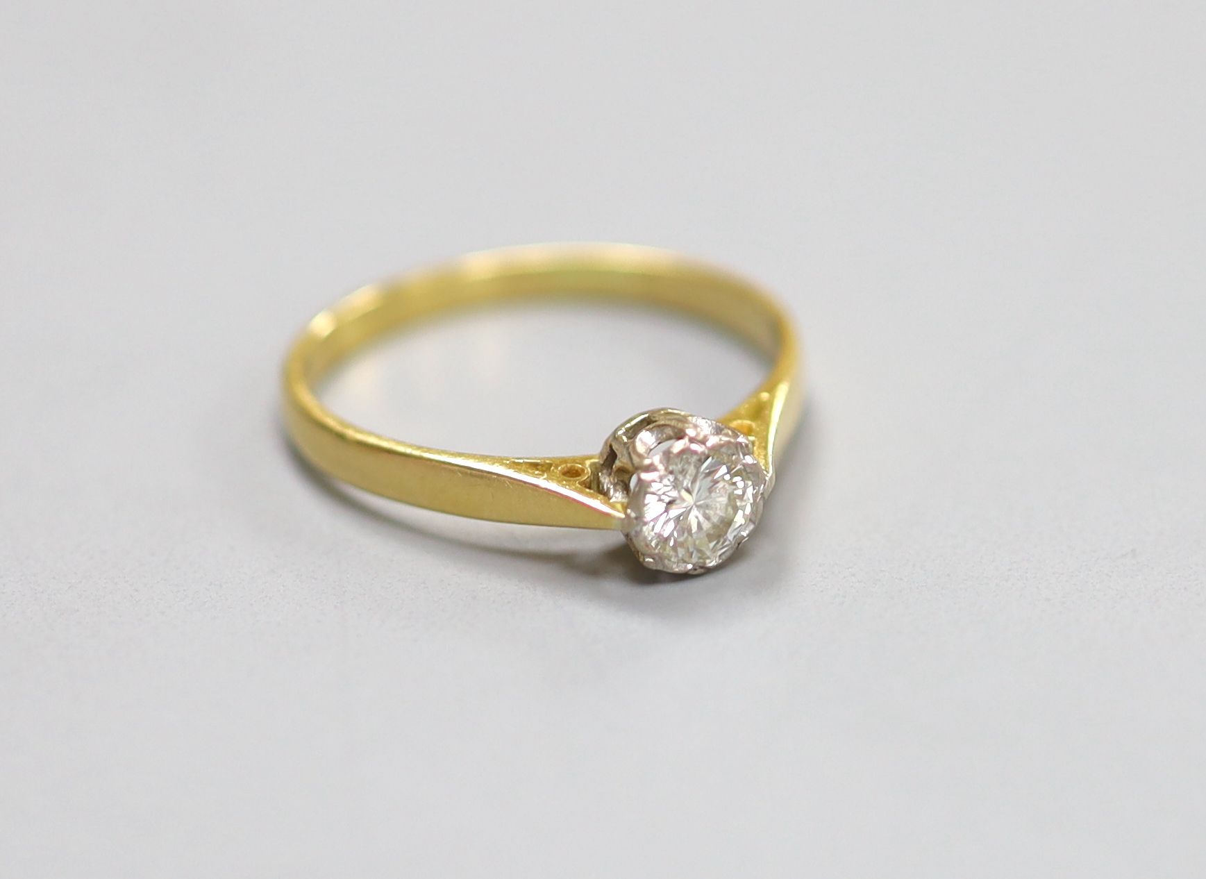 An 18ct and solitaire diamond ring